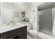 Bathroom featuring modern vanity, framed mirror, and glass-enclosed shower at 4650 Wonderful St, Las Vegas, NV 89147