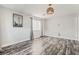 An empty bedroom with wood-look flooring and neutral colored walls at 4650 Wonderful St, Las Vegas, NV 89147