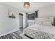 Relaxing bedroom features a comfortable bed, closet, and wood-look floors at 4650 Wonderful St, Las Vegas, NV 89147