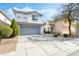 Beautiful two-story home with mature landscaping and a spacious driveway at 4650 Wonderful St, Las Vegas, NV 89147