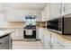 Bright kitchen with stainless steel appliances, ample storage, and granite countertops at 4650 Wonderful St, Las Vegas, NV 89147