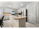 Modern kitchen with a center island, stainless steel appliances, and ample cabinet space at 4650 Wonderful St, Las Vegas, NV 89147