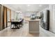 Bright kitchen and dining area with stainless steel appliances and center island at 4650 Wonderful St, Las Vegas, NV 89147