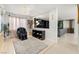 Bright living room features a massage chair, modern lighting, and stylish decor at 4650 Wonderful St, Las Vegas, NV 89147