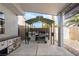 Outdoor kitchen area featuring a grill, cabinets, and a shade canopy in the backyard at 4650 Wonderful St, Las Vegas, NV 89147