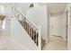 Elegant staircase features wood and wrought iron design, with tile flooring at 4650 Wonderful St, Las Vegas, NV 89147