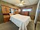 Comfortable bedroom featuring wood-paneled walls and built-in wood storage at 4964 Dunkirk Ave, Las Vegas, NV 89121