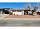 Charming single-story home with a well-kept front yard and covered parking at 4964 Dunkirk Ave, Las Vegas, NV 89121