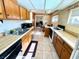 Traditional eat-in kitchen featuring wooden cabinets, updated appliances, and neutral countertops at 4964 Dunkirk Ave, Las Vegas, NV 89121