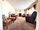 Inviting living room with neutral walls, carpet, and a comfortable seating area at 4964 Dunkirk Ave, Las Vegas, NV 89121