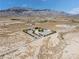 Aerial view of property, highlighting the desert landscape and the enclosed lot at 5090 N David St, Pahrump, NV 89060