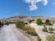 An aerial view of a desert home showcasing the large lot, mountain views and surrounding landscape at 5090 N David St, Pahrump, NV 89060