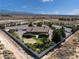 Wide aerial view of the property featuring desert landscape and a privacy wall at 5090 N David St, Pahrump, NV 89060