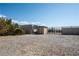 Gravel backyard with a large shed, dog run, and additional storage for your outdoor needs at 5090 N David St, Pahrump, NV 89060