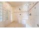 Spacious bathroom features tiled shower with dual shower heads and built-in bench at 5090 N David St, Pahrump, NV 89060