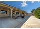 Relaxing covered patio area with comfortable seating, outdoor grill, and expansive desert views at 5090 N David St, Pahrump, NV 89060
