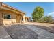 Exterior shot of a home with a stone pathway leading to a column-lined covered porch at 5090 N David St, Pahrump, NV 89060