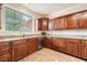 Beautiful kitchen with stainless steel appliances, granite countertops, and dark wood cabinetry at 5090 N David St, Pahrump, NV 89060