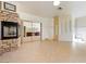 Spacious main bedroom featuring a fireplace, tile floors, and a mirrored closet that reflects the bathroom at 5090 N David St, Pahrump, NV 89060
