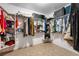 This walk-in closet has lots of hanging storage and shelving for storing all types of clothing and accessories at 5090 N David St, Pahrump, NV 89060