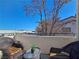 Relaxing balcony seating with views of surrounding neighborhood and blue skies at 5092 Mandalay Springs Dr # 201, Las Vegas, NV 89120
