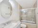 Bright bathroom featuring tiled shower-tub combo, modern fixtures, and a spacious vanity at 5092 Mandalay Springs Dr # 201, Las Vegas, NV 89120