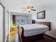 Comfortable bedroom with hardwood floors and a large window at 5092 Mandalay Springs Dr # 201, Las Vegas, NV 89120