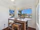 Bright breakfast nook with a view of the outdoors through large windows at 5092 Mandalay Springs Dr # 201, Las Vegas, NV 89120