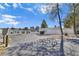 View of the gated entrance to Canyon Willow, a gated community with well-maintained landscaping and a secure environment at 5092 Mandalay Springs Dr # 201, Las Vegas, NV 89120
