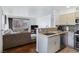 Open kitchen flowing into the living area, equipped with stainless steel appliances and granite countertops at 5092 Mandalay Springs Dr # 201, Las Vegas, NV 89120