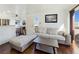 Open living area showcasing kitchen and a comfortable sectional sofa at 5092 Mandalay Springs Dr # 201, Las Vegas, NV 89120