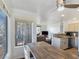 Bright, open-concept living space with modern furnishings and dining area at 5092 Mandalay Springs Dr # 201, Las Vegas, NV 89120