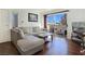 Bright living room with hardwood floors and a comfortable sectional sofa at 5092 Mandalay Springs Dr # 201, Las Vegas, NV 89120