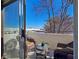 Cozy patio with seating and a view of the mountains in the distance at 5092 Mandalay Springs Dr # 201, Las Vegas, NV 89120