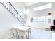 Bright living area with vaulted ceilings, natural light, and staircase with iron railing at 5476 Green Horn St, Las Vegas, NV 89118