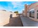 The backyard boasts a dirt area and concrete patio, offering space for outdoor activities and leisure at 6224 Mandarin Dr, Las Vegas, NV 89108