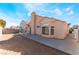 View of the backyard with a dirt area and concrete patio, ideal for outdoor gatherings and enjoyment at 6224 Mandarin Dr, Las Vegas, NV 89108