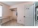 Bedroom featuring a built-in desk and shelving, a closet, and tile floors at 6224 Mandarin Dr, Las Vegas, NV 89108