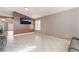 Large, bright living room with tile floors, neutral walls, and modern sofas at 6224 Mandarin Dr, Las Vegas, NV 89108