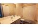 Standard bathroom featuring single vanity, toilet, and shower-tub combo at 6239 Carson Hills Ave, Las Vegas, NV 89139