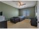 Neutral toned bedroom with ceiling fan and view of the neighborhood at 6308 Lauren Ashton Ave, Las Vegas, NV 89131