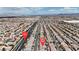 Expansive aerial view of a well-planned residential neighborhood with mountain views, near W. Windmill Ln. for convenient access at 6461 Mount Eden Ave, Las Vegas, NV 89139