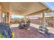Enjoy this backyard featuring a covered patio, brick pavers, and outdoor seating at 6461 Mount Eden Ave, Las Vegas, NV 89139