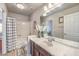Bathroom with white marble countertop vanity and tub and shower combo at 6461 Mount Eden Ave, Las Vegas, NV 89139
