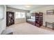 Cozy bedroom with a bunk bed, bookshelf, and window with natural light at 6461 Mount Eden Ave, Las Vegas, NV 89139