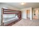 Bedroom with a bunk bed and view into closet and through to a hallway at 6461 Mount Eden Ave, Las Vegas, NV 89139