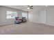 Spacious bedroom featuring neutral color palette, carpet, and two windows that provide lots of natural light at 6461 Mount Eden Ave, Las Vegas, NV 89139
