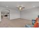 Large open bonus room featuring neutral carpet, a ceiling fan, and plenty of natural light at 6461 Mount Eden Ave, Las Vegas, NV 89139