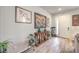 Welcoming entryway with attractive artwork and decor, and lovely hardwood flooring at 6461 Mount Eden Ave, Las Vegas, NV 89139