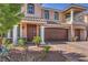 Charming two-story house boasting a beautifully landscaped front yard and a spacious two-car garage at 6461 Mount Eden Ave, Las Vegas, NV 89139
